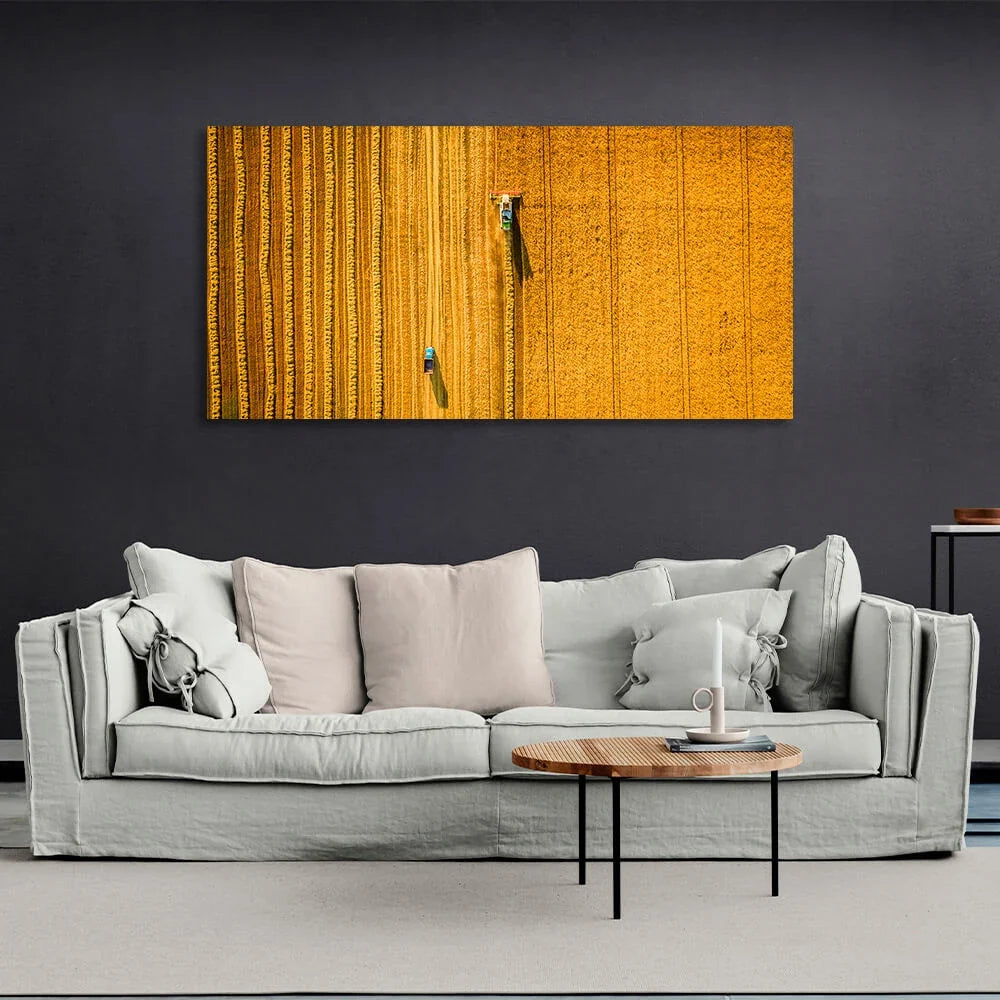 Combine machine in grain field from above Canvas Wall Art Print