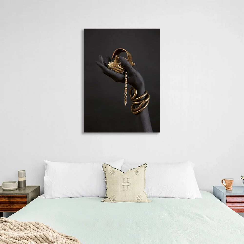 The black hand of a woman with gold jewelry Canvas Wall Art Print