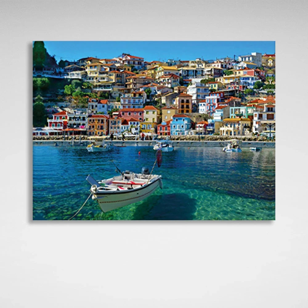 A boat in an incredibly clear sea against the backdrop of a brightly colored city Canvas Wall Art Print