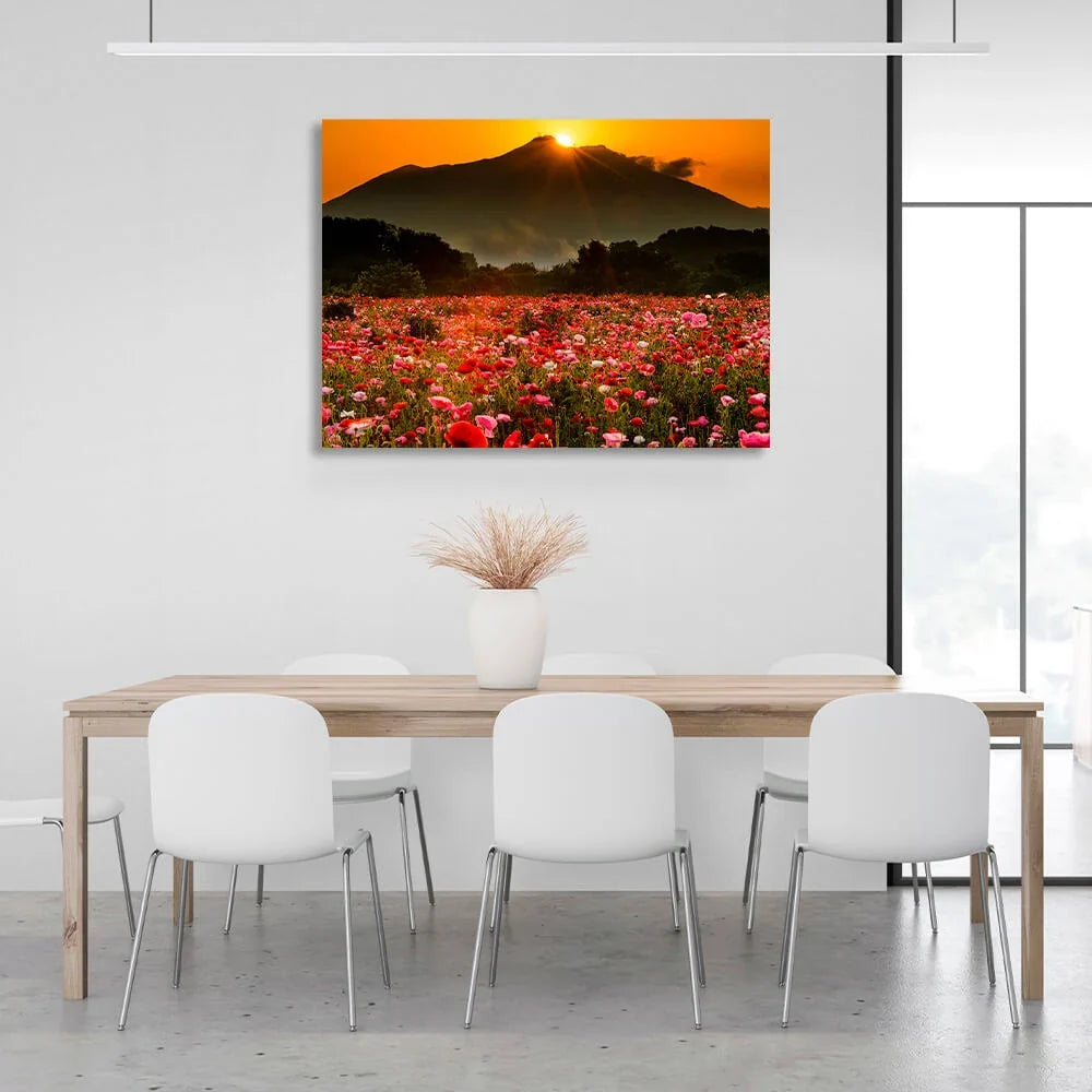 A field of poppies against a background of forest, mountains and sunset Canvas Wall Art Print