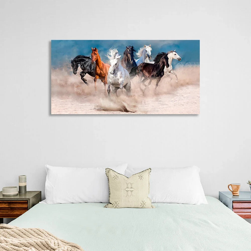 Horizontal picture of 7 horses running through the desert on the background of blue sky Canvas Wall Art Print